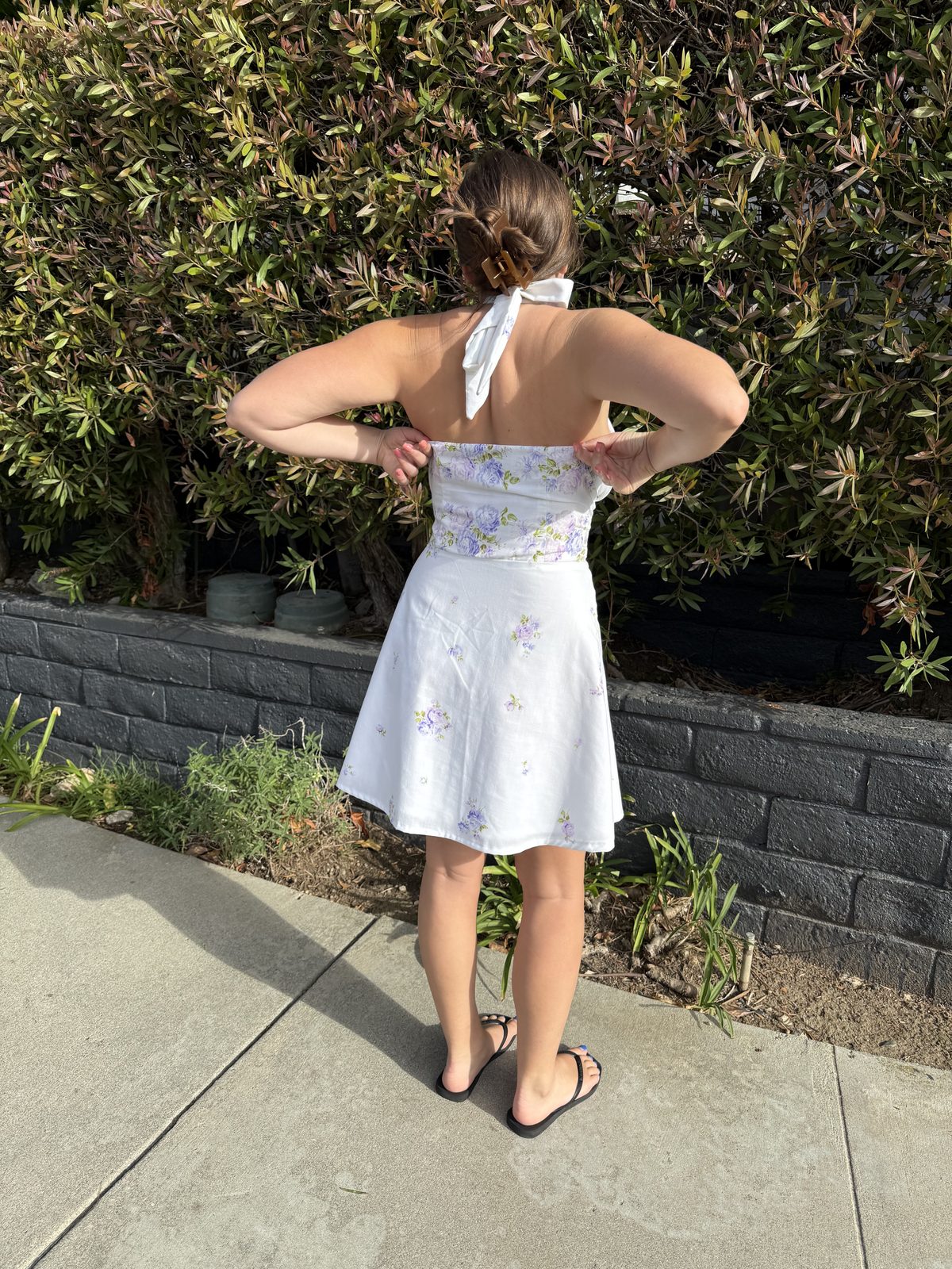 The back of the finished Margot dress, showing the halter tie and the floral waistband wrapping around